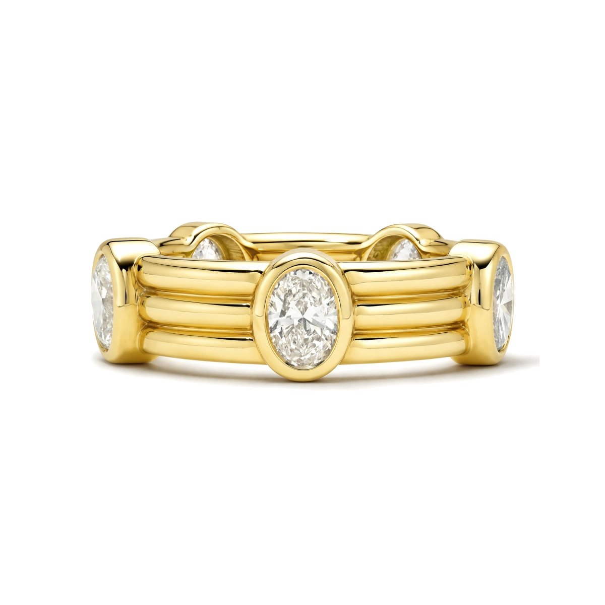 Gold ring with oval diamonds on a white background